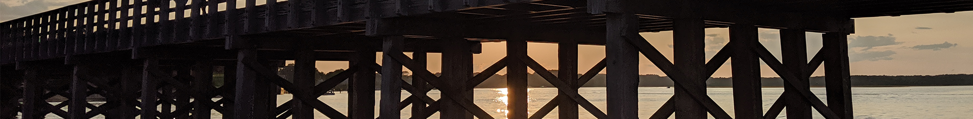 Sunset under the pier at Duxbury Bay
